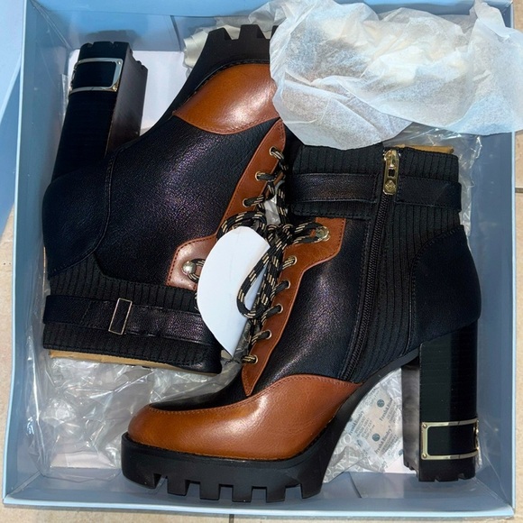 Antonio Melani Perline Leather Lace-Up Chunky Lug Sole Platform Heel Booties.